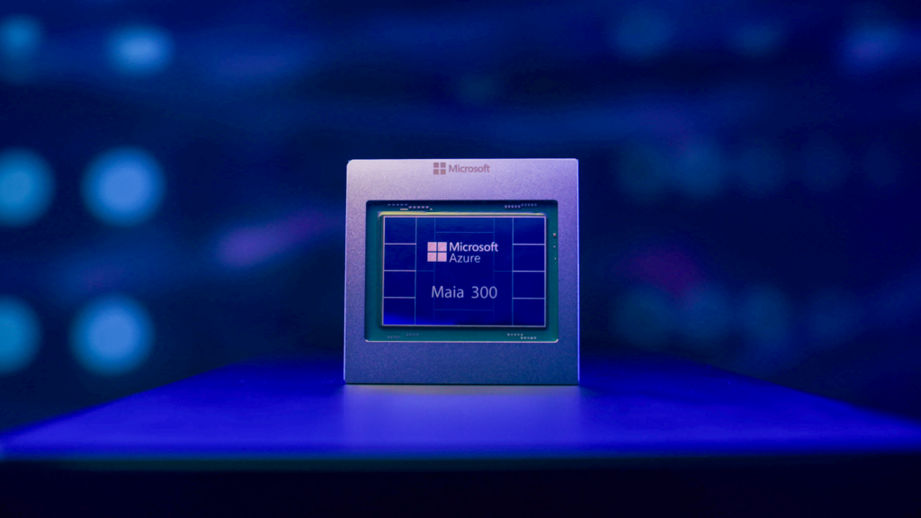 A Microsoft Azure Maia 300 AI accelerator chip sits on a pedestal against a blue, abstract digital background.